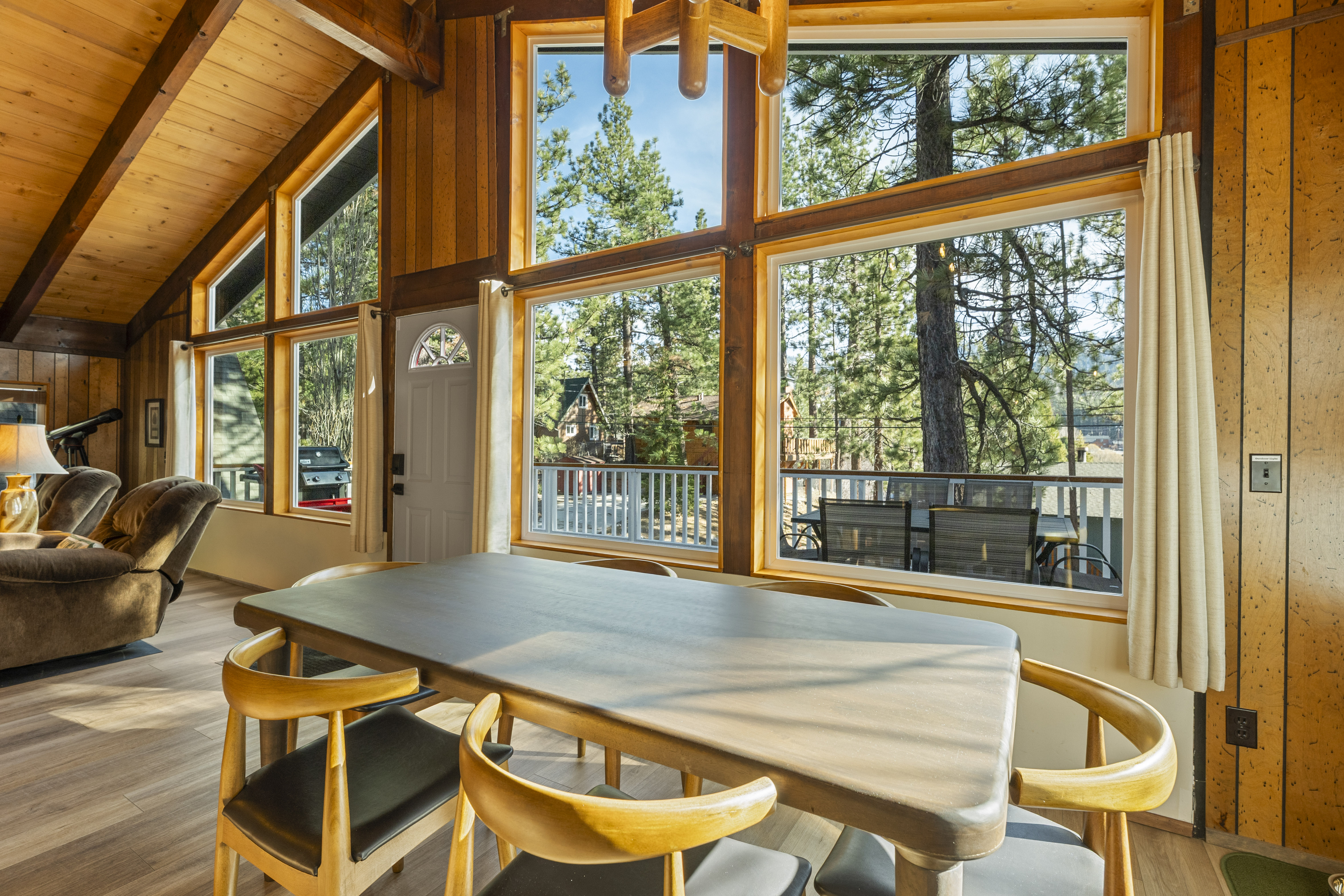 Dining area with large windows and forest views at Bear View Escape